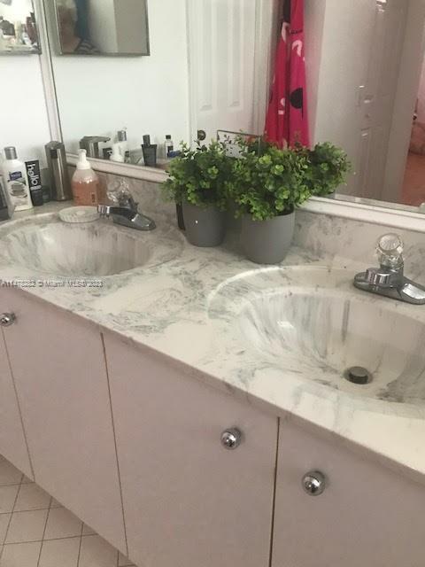Savanna Weston, FL 33327 - Photo 17 of 21 a bathroom with a granite countertop sink a mirror and shower