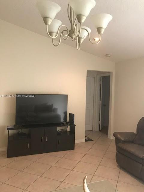 Savanna Weston, FL 33327 - Photo 9 of 21 a living room with furniture and a flat screen tv