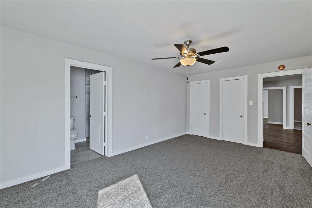 907 Southwest Main Street Ennis, TX 75119 - Photo 16 of 28 a living room with furniture and a ceiling fan