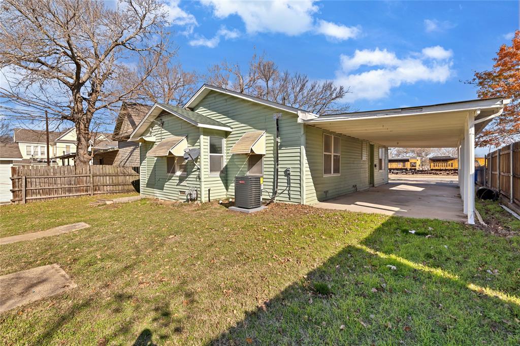 907 Southwest Main Street Ennis, TX 75119 - Photo 26 of 28 a view of a house with a patio
