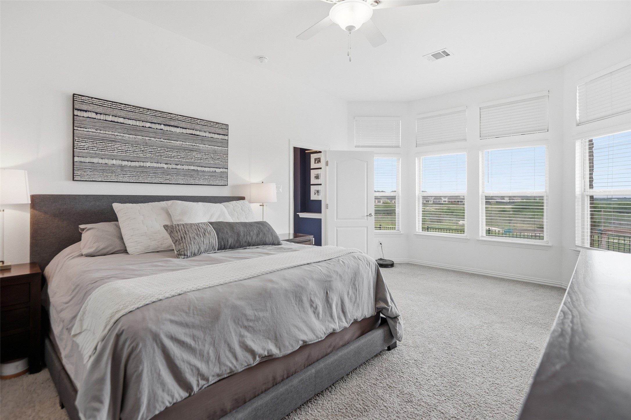 544 Cherrystone Loop Buda, TX 78610 - Photo 13 of 40 a spacious bedroom with a bed and window
