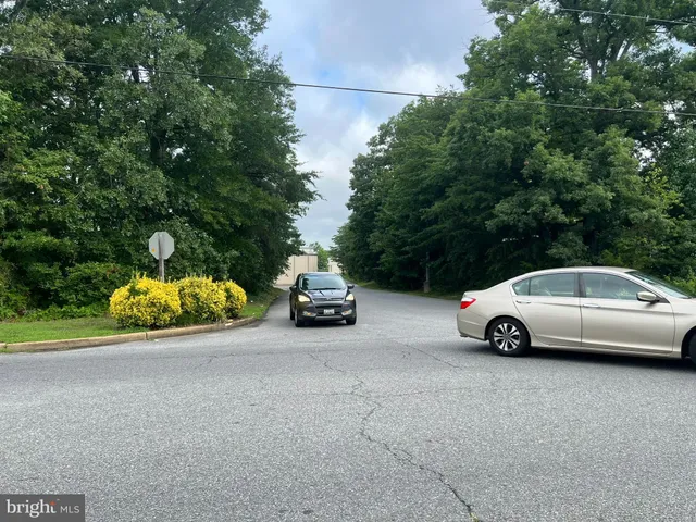 a view of street with parked cars