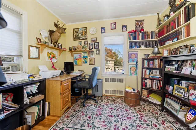 a view of a workspace with furniture and toys