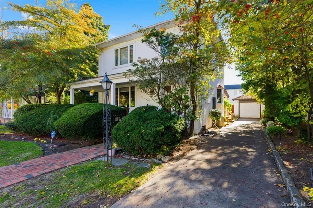 a view of a front of a house with a small yard