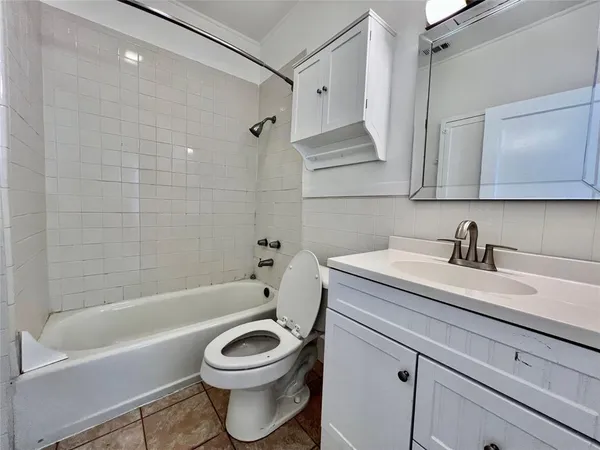 a bathroom with a sink a toilet and a bathtub