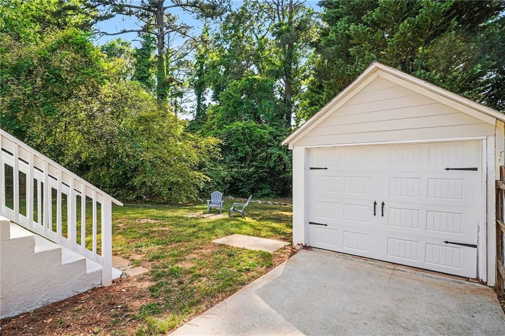 1275 Westridge Road Southwest Atlanta, GA 30311 - Photo 26 of 34 a view of a house with a yard