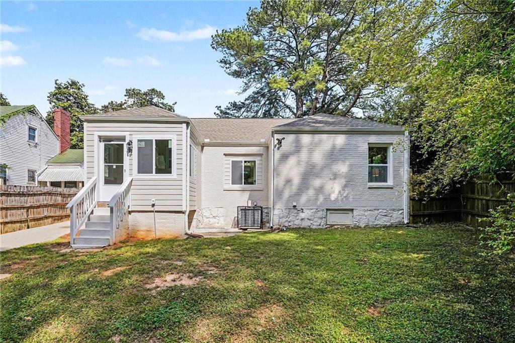 1275 Westridge Road Southwest Atlanta, GA 30311 - Photo 28 of 34 a view of a house with a yard and sitting area