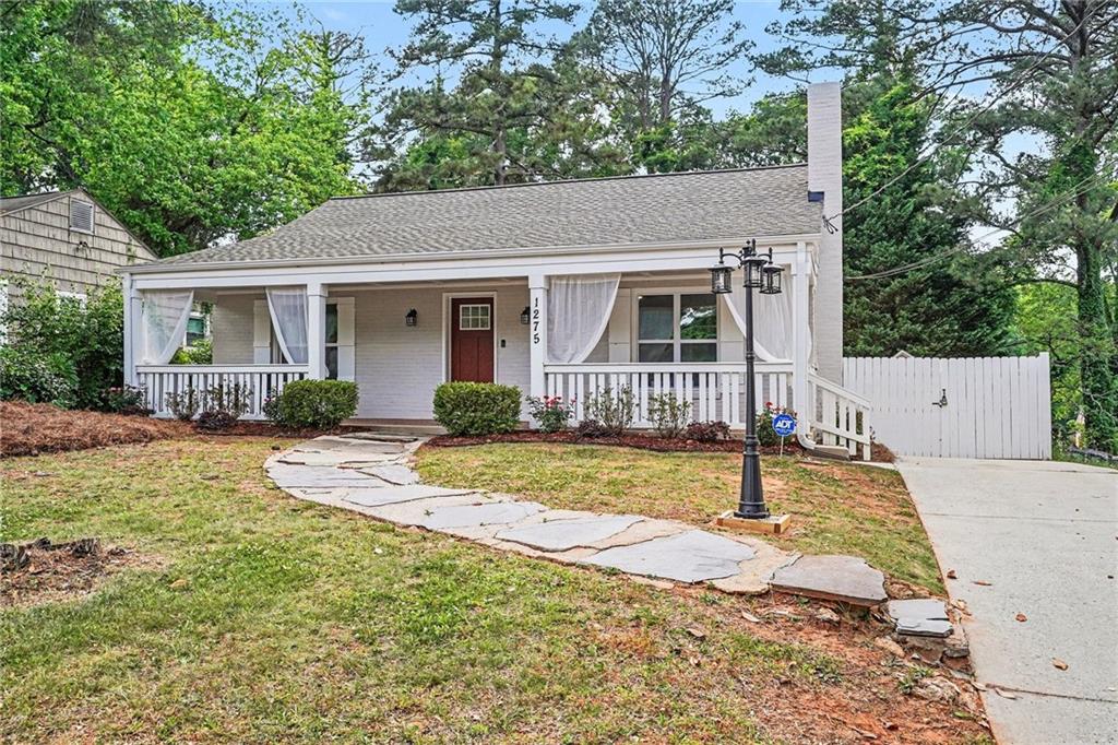 1275 Westridge Road Southwest Atlanta, GA 30311 - Photo 33 of 34 a view of a house with backyard and sitting area