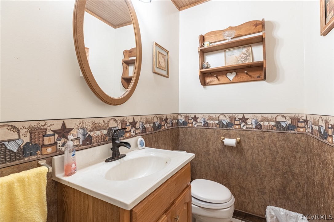 12408 Bailey Bridge Road Midlothian, VA 23112 - Photo 13 of 49 a bathroom with a toilet a sink and a mirror