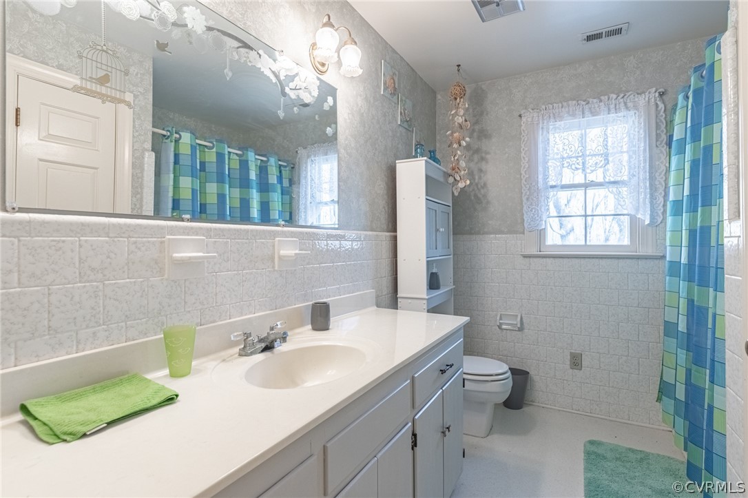12408 Bailey Bridge Road Midlothian, VA 23112 - Photo 28 of 49 a bathroom with a sink a toilet and a mirror