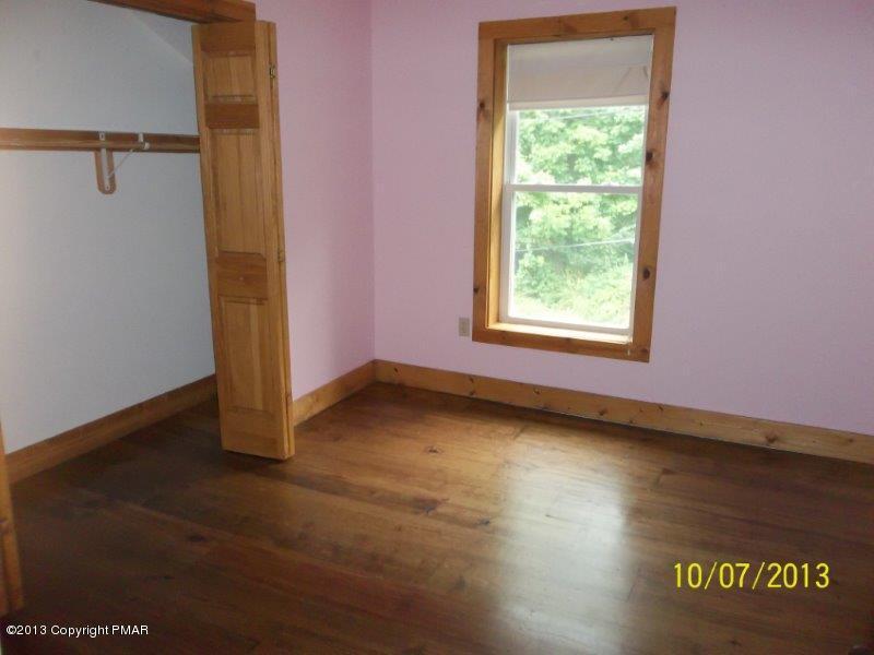 130 Donaldson Road Cresco, PA 18326 - Photo 12 of 20 a view of an empty room with a window