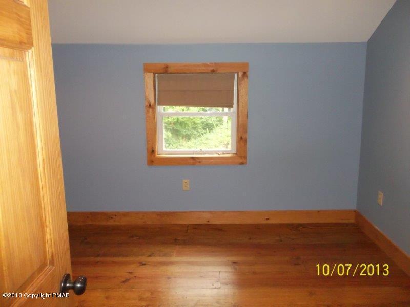130 Donaldson Road Cresco, PA 18326 - Photo 13 of 20 a view of an empty room with a window