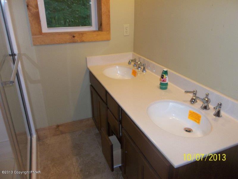 130 Donaldson Road Cresco, PA 18326 - Photo 18 of 20 a bathroom with a sink and a window