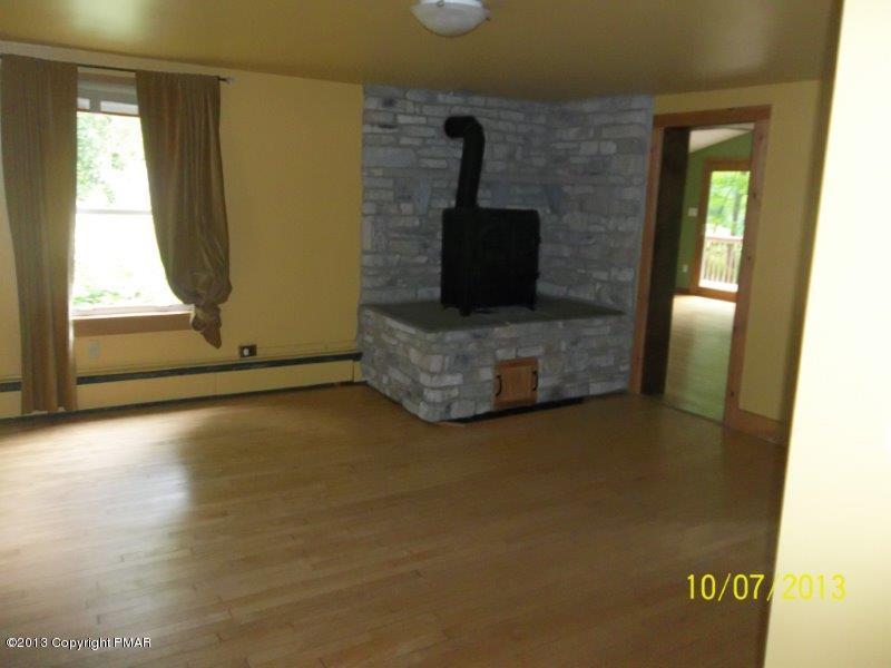 130 Donaldson Road Cresco, PA 18326 - Photo 5 of 20 a view of an empty room and window