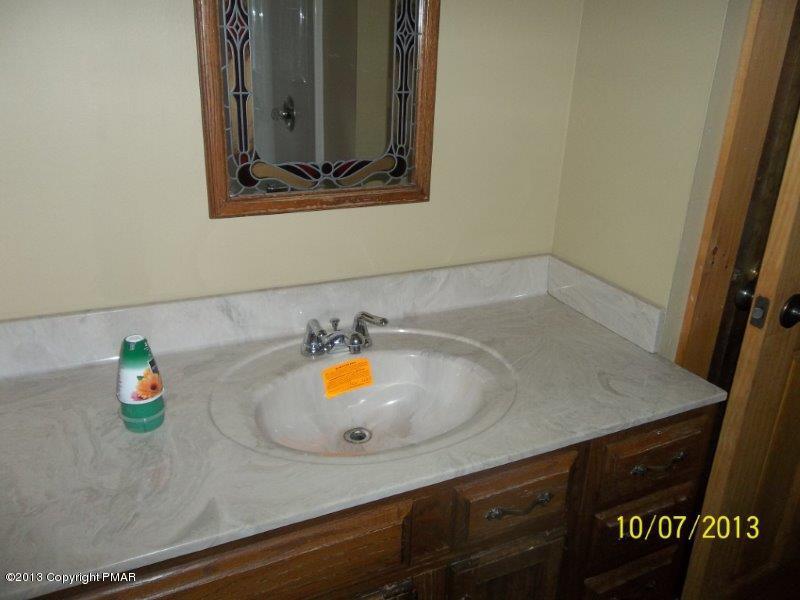 130 Donaldson Road Cresco, PA 18326 - Photo 9 of 20 a bathroom with a sink and a vanity