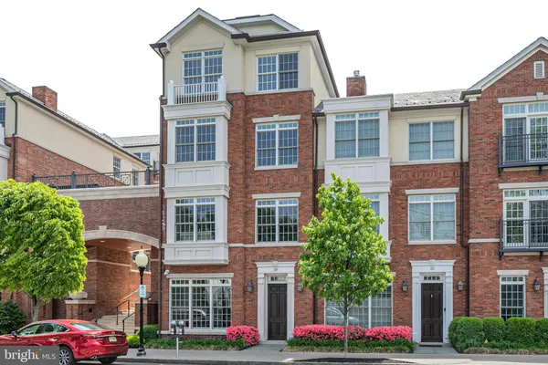 a front view of building with cars