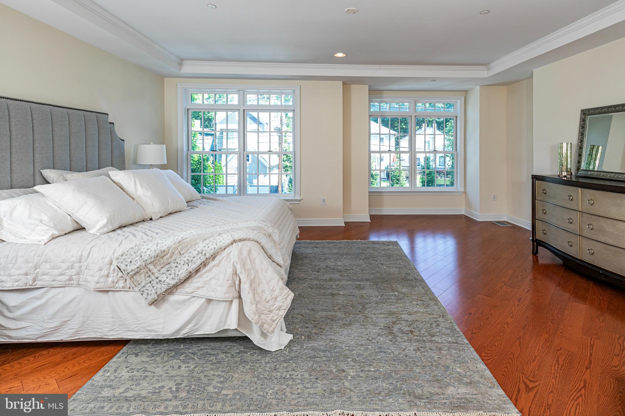 20 Paul Robeson Place Princeton, NJ 08542 - Photo 19 of 32 a spacious bedroom with a bed and wooden floor