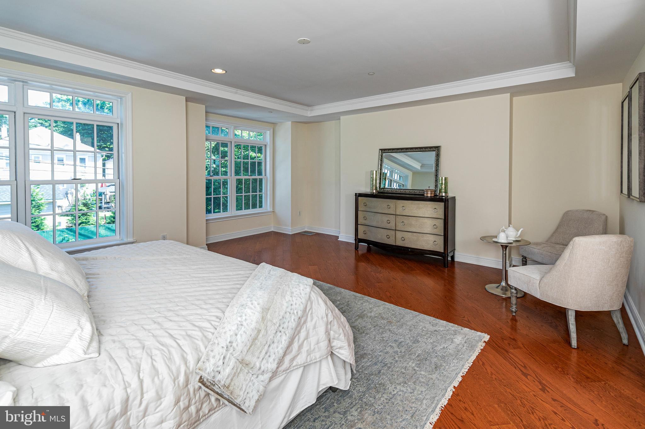 20 Paul Robeson Place Princeton, NJ 08542 - Photo 20 of 32 a bedroom with a bed and a chair