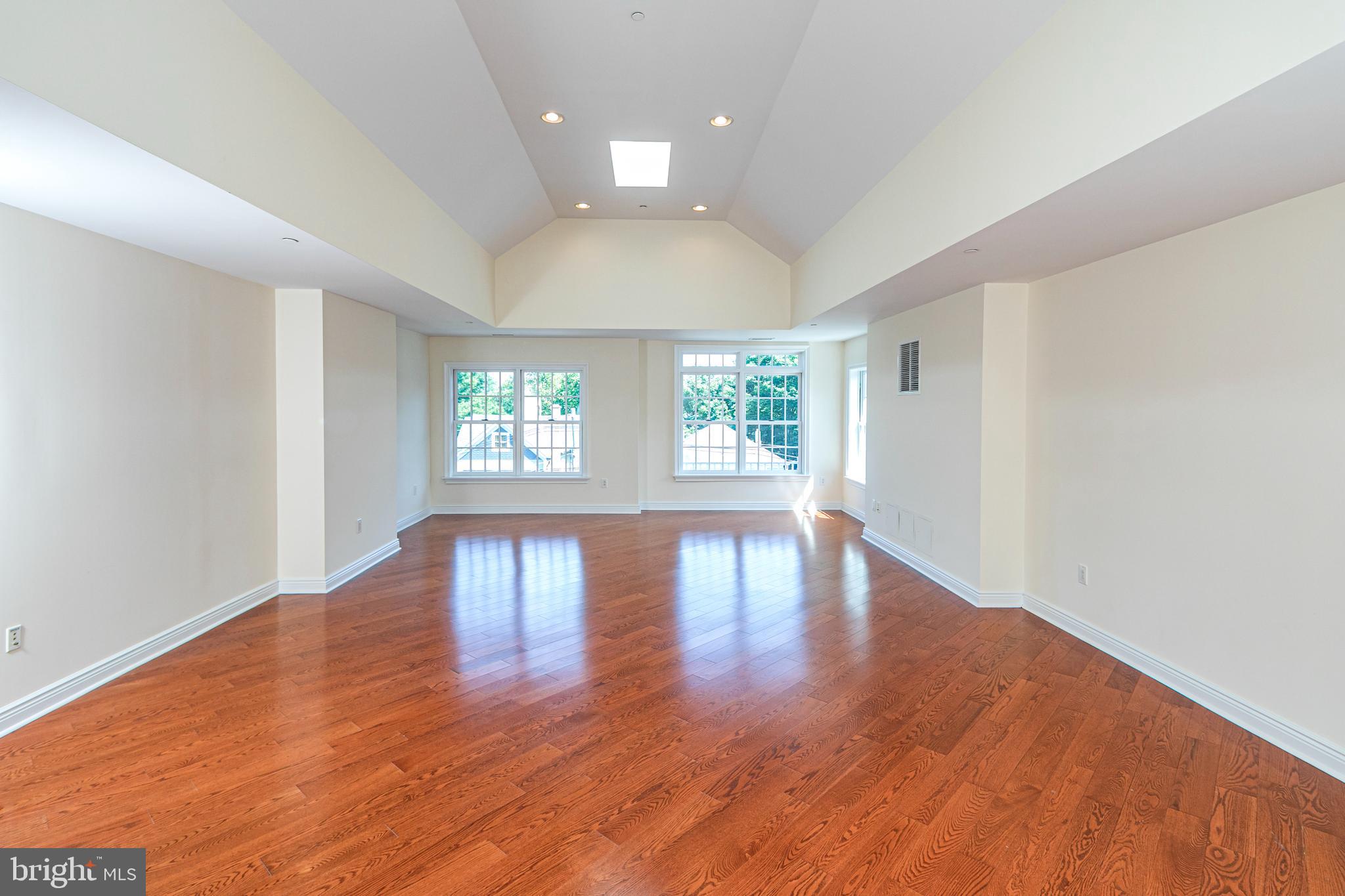 20 Paul Robeson Place Princeton, NJ 08542 - Photo 29 of 32 an empty room with wooden floor and windows