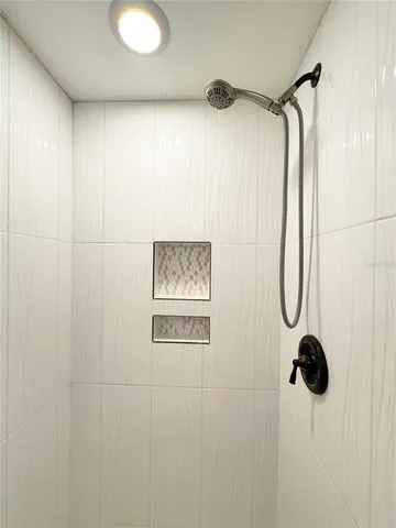 a white toilet sitting next to a bathroom sink