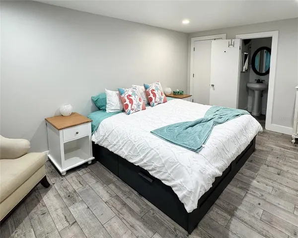 a utility room with a sink and a mirror
