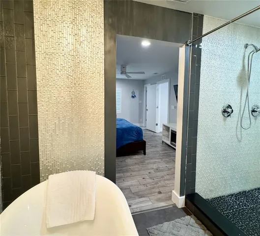 a white bath tub sitting in a bathroom