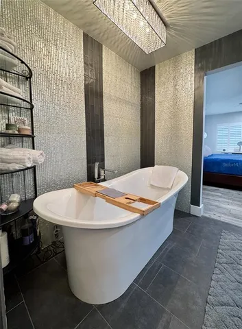 a balcony with furniture and a potted plant