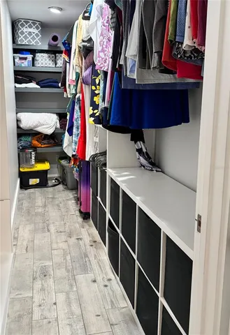 a view of a kitchen with a stove top oven