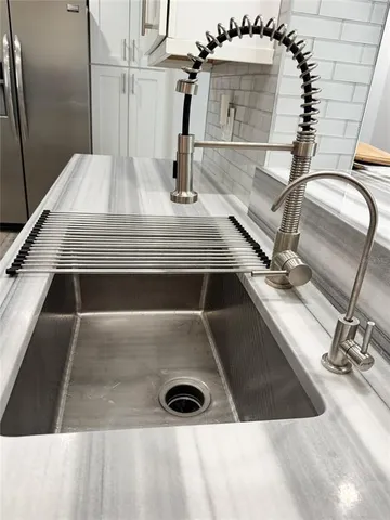 a view of a dining room with furniture and window