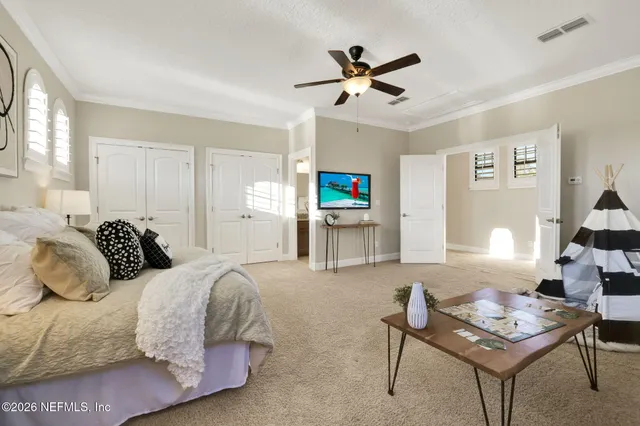 a bathroom with a granite countertop sink a toilet and mirror