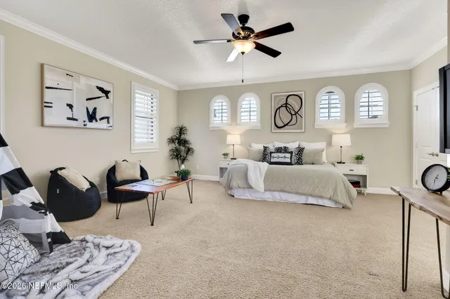 a bedroom with a bed furniture and window