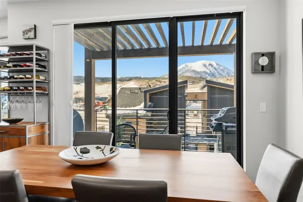 a view of a dining room with furniture window and wooden floor