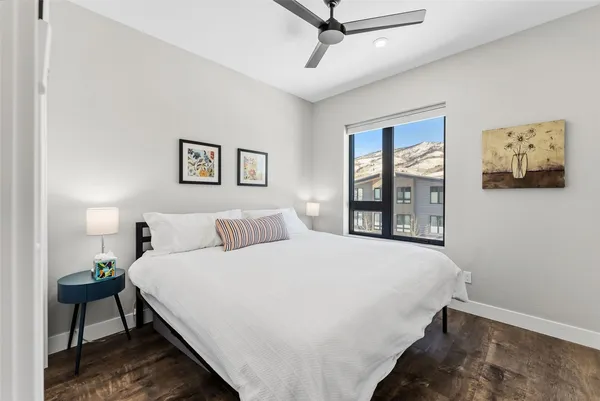 a bedroom with a large bed and a window