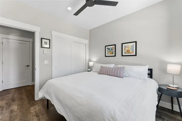 a bedroom with a bed and a lamp