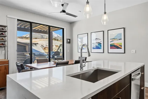 a kitchen with a sink and a large window