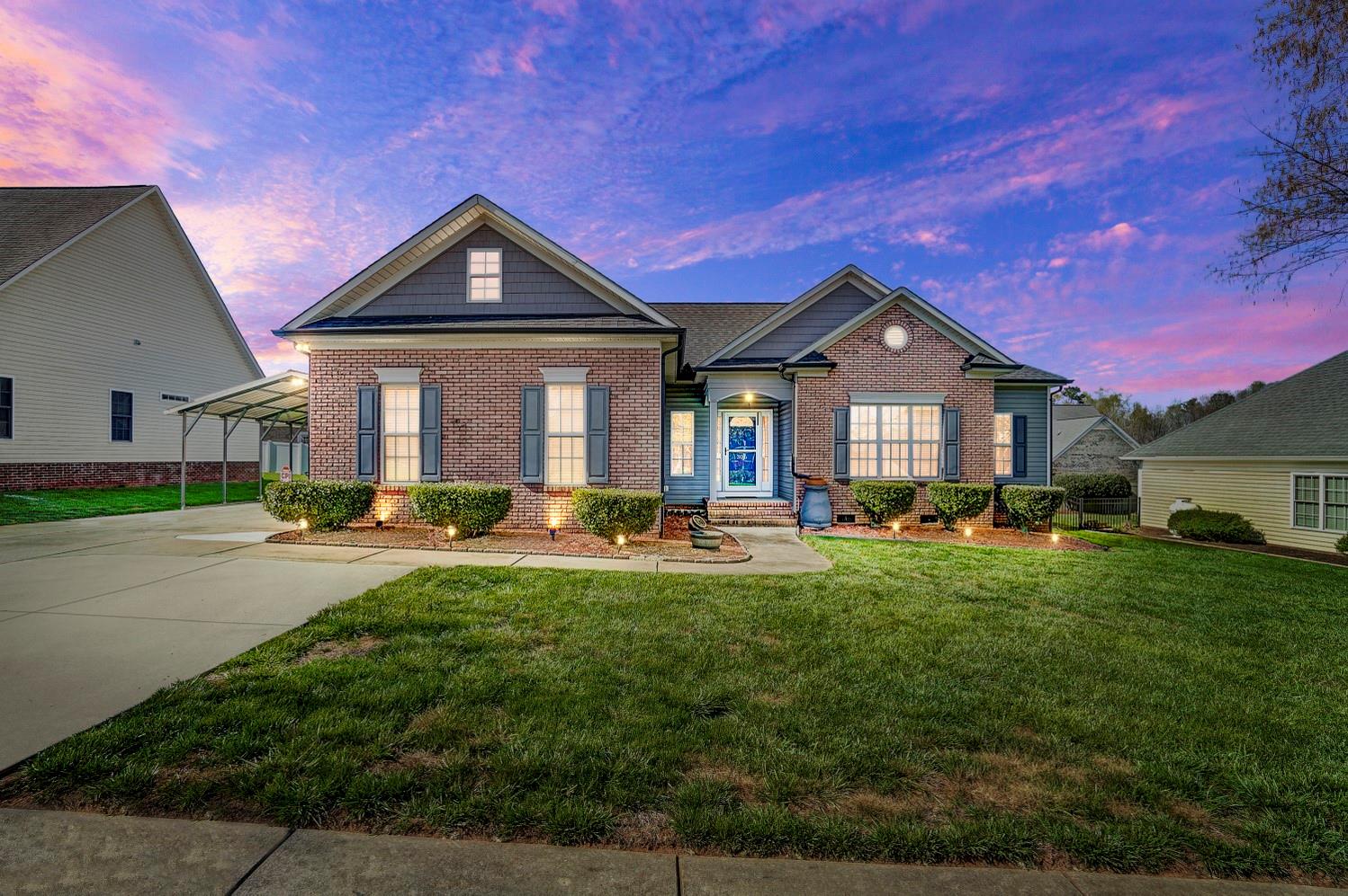 306 Wendover Drive Locust, NC 28097 - Photo 1 of 42 a front view of a house with yard and green space