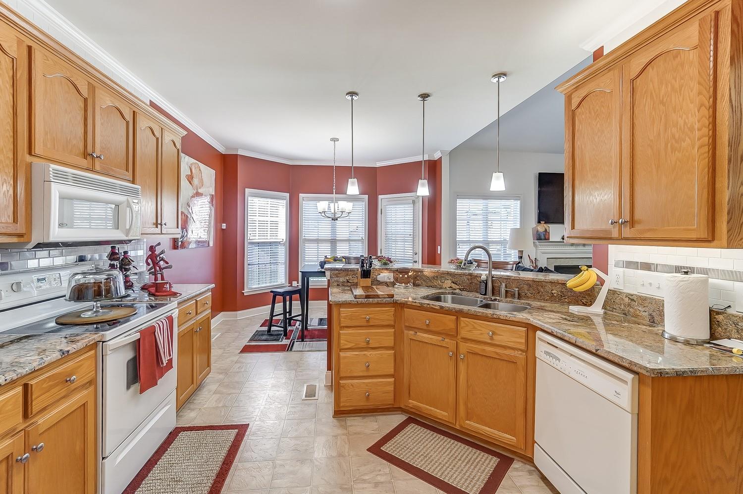 306 Wendover Drive Locust, NC 28097 - Photo 11 of 42 a kitchen with lots of counter top space a sink appliances and cabinets