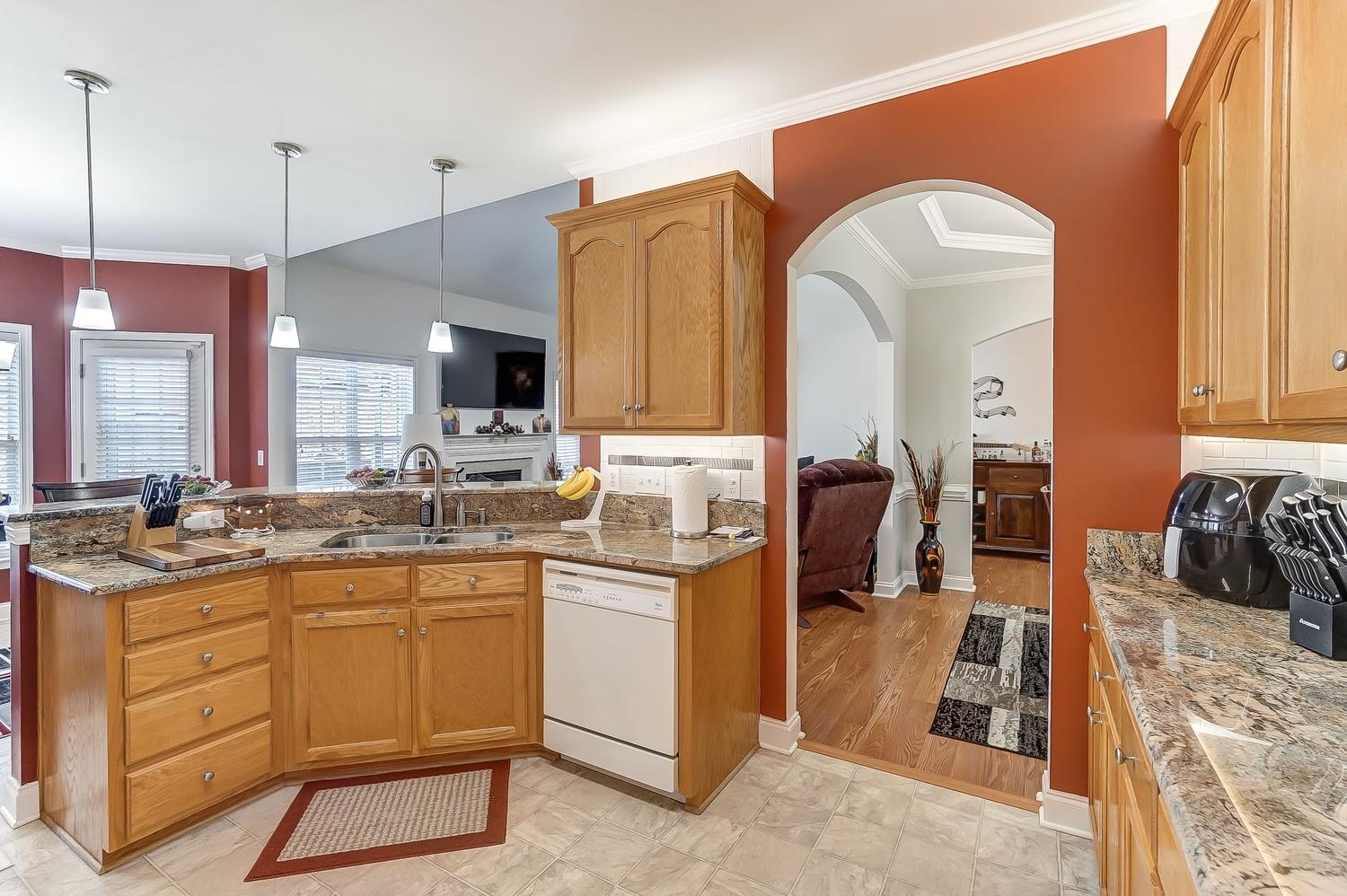 306 Wendover Drive Locust, NC 28097 - Photo 12 of 42 a kitchen with a sink stove and cabinets
