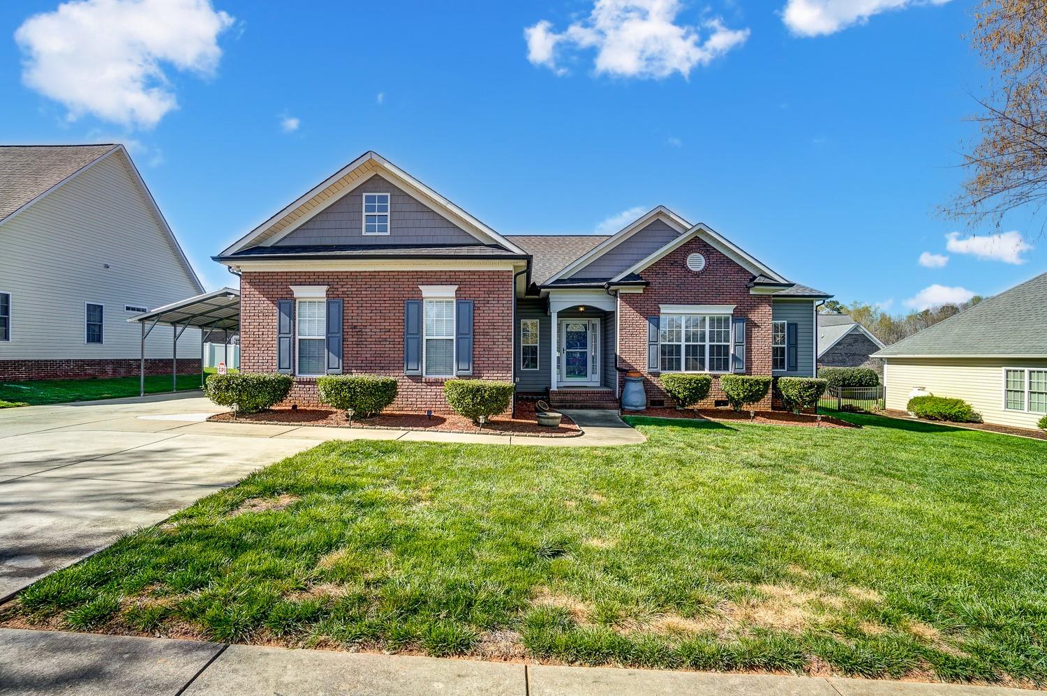 306 Wendover Drive Locust, NC 28097 - Photo 2 of 42 a front view of a house with yard porch and livingroom