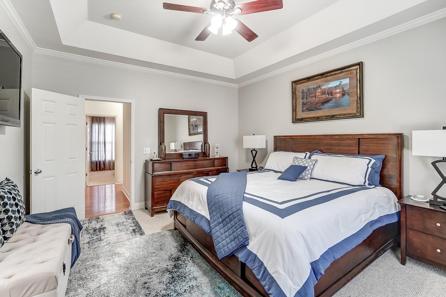 306 Wendover Drive Locust, NC 28097 - Photo 24 of 42 a bedroom with bed and a chandelier