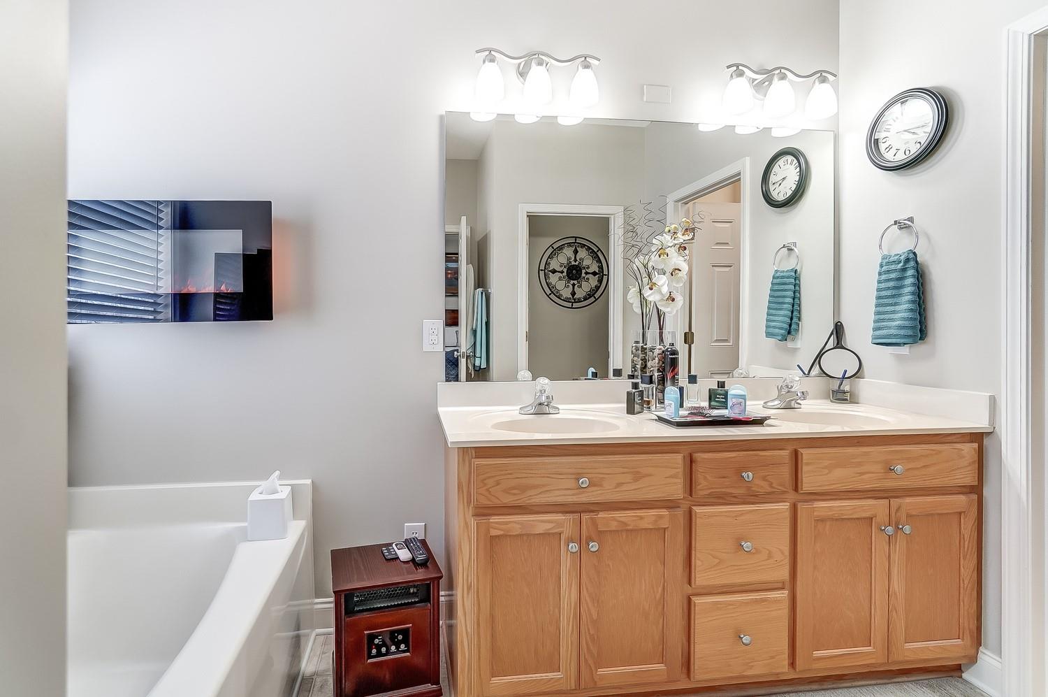 306 Wendover Drive Locust, NC 28097 - Photo 26 of 42 a bathroom with a sink and a mirror