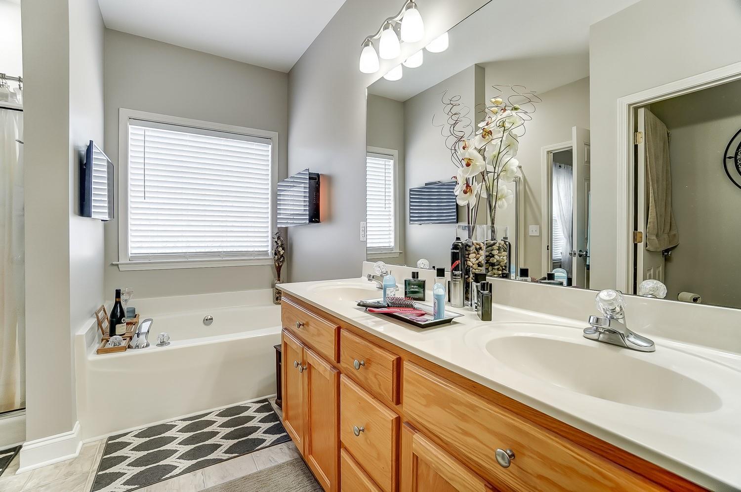 306 Wendover Drive Locust, NC 28097 - Photo 27 of 42 a bathroom with a tub sink and mirror