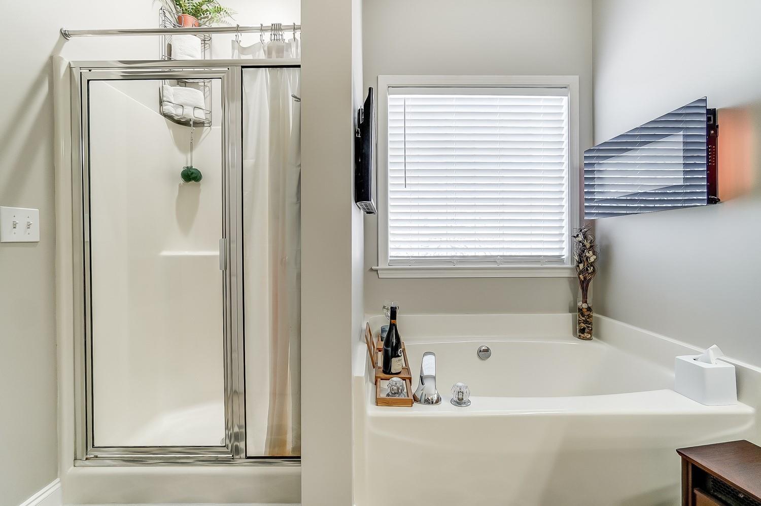 306 Wendover Drive Locust, NC 28097 - Photo 28 of 42 a white bath tub sitting next to a white sink