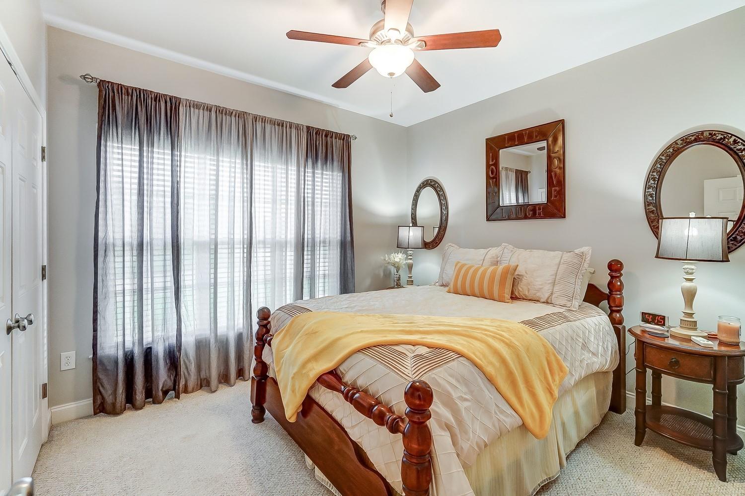 306 Wendover Drive Locust, NC 28097 - Photo 33 of 42 a bedroom with bed and a chandelier