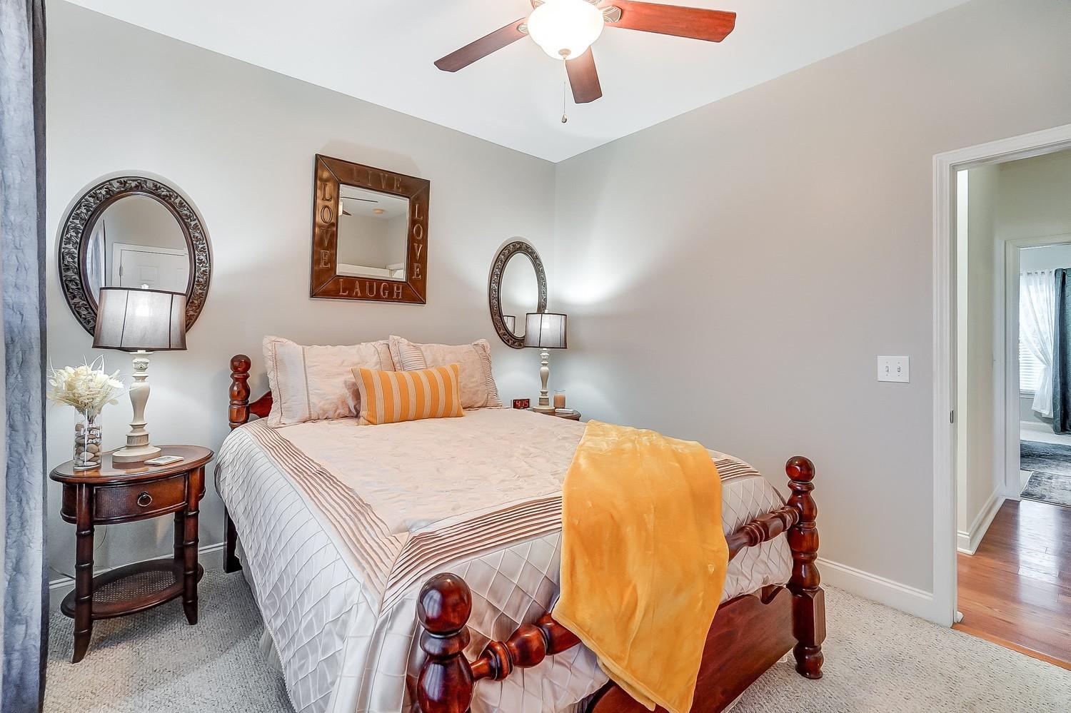 306 Wendover Drive Locust, NC 28097 - Photo 34 of 42 a bedroom with a bed and a chandelier