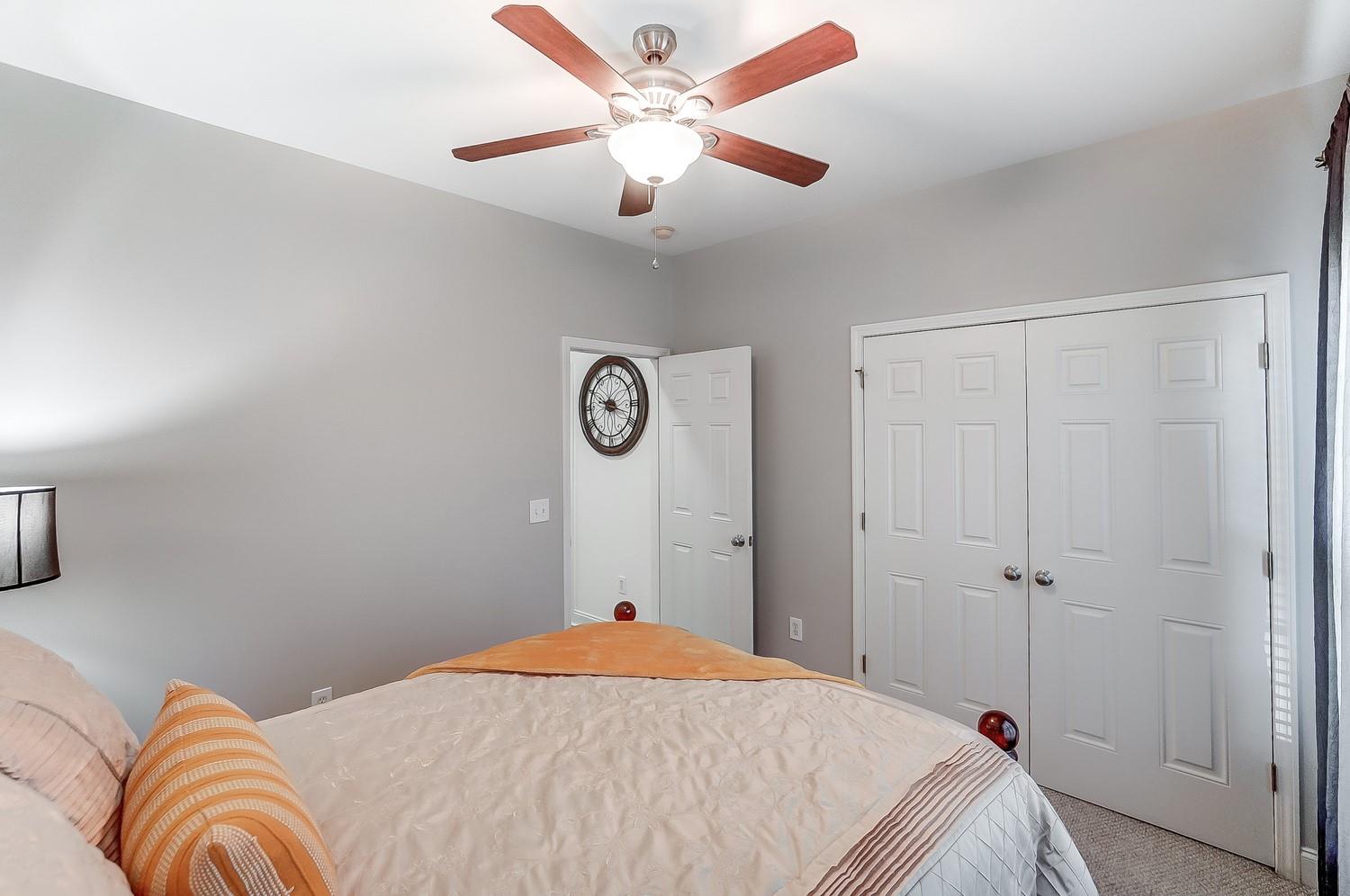 306 Wendover Drive Locust, NC 28097 - Photo 35 of 42 a bedroom with a bed and a chandelier