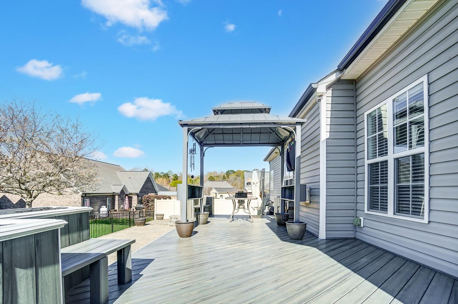 306 Wendover Drive Locust, NC 28097 - Photo 40 of 42 a view of a patio with table and chairs a barbeque with wooden floor and fence