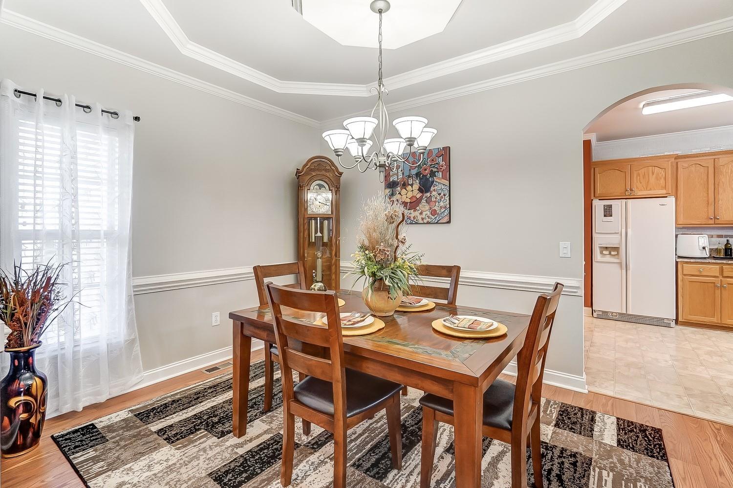 306 Wendover Drive Locust, NC 28097 - Photo 6 of 42 a view of a dining room with furniture window and wooden floor