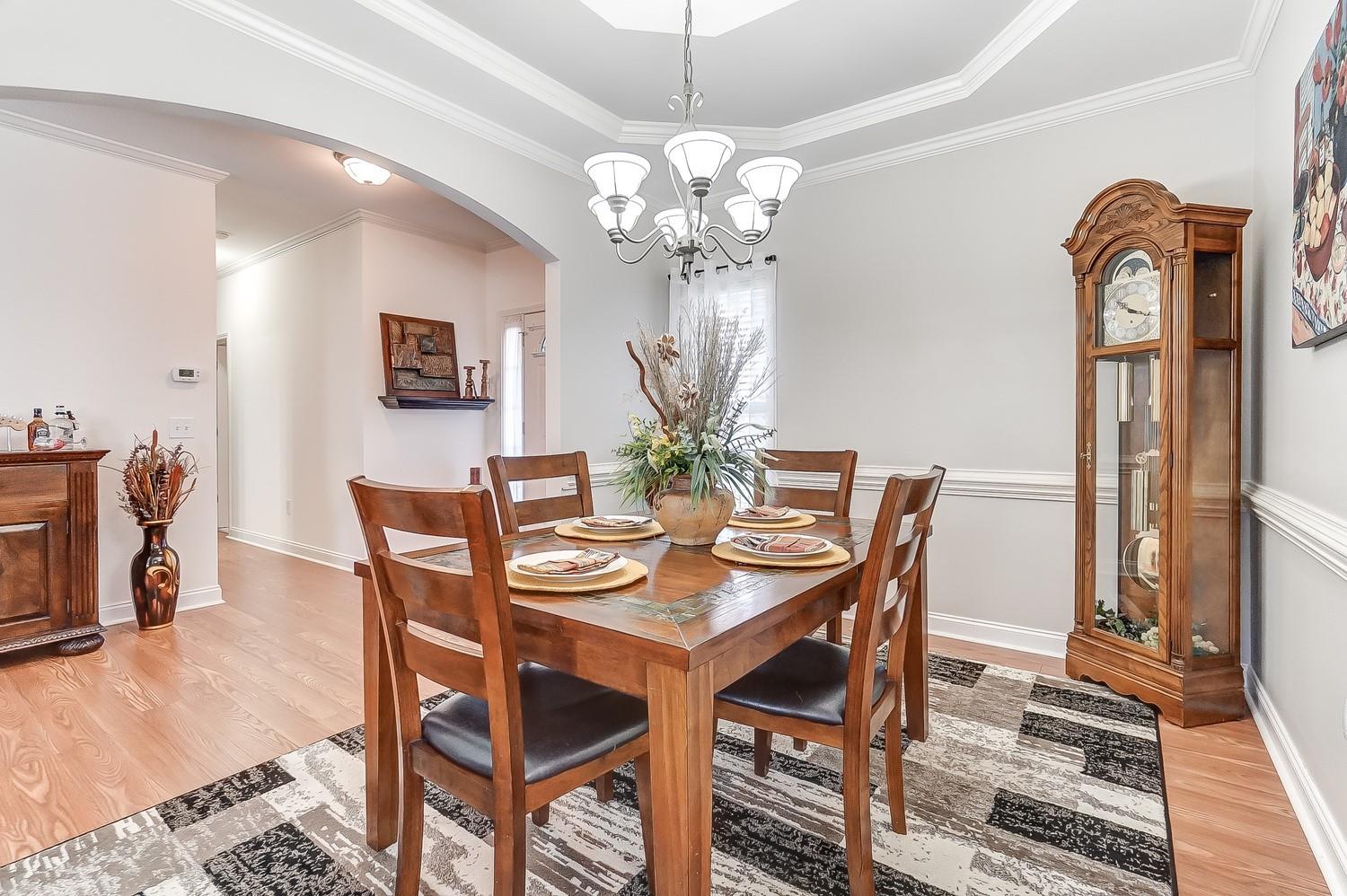 306 Wendover Drive Locust, NC 28097 - Photo 7 of 42 a view of a dining room with furniture and chandelier