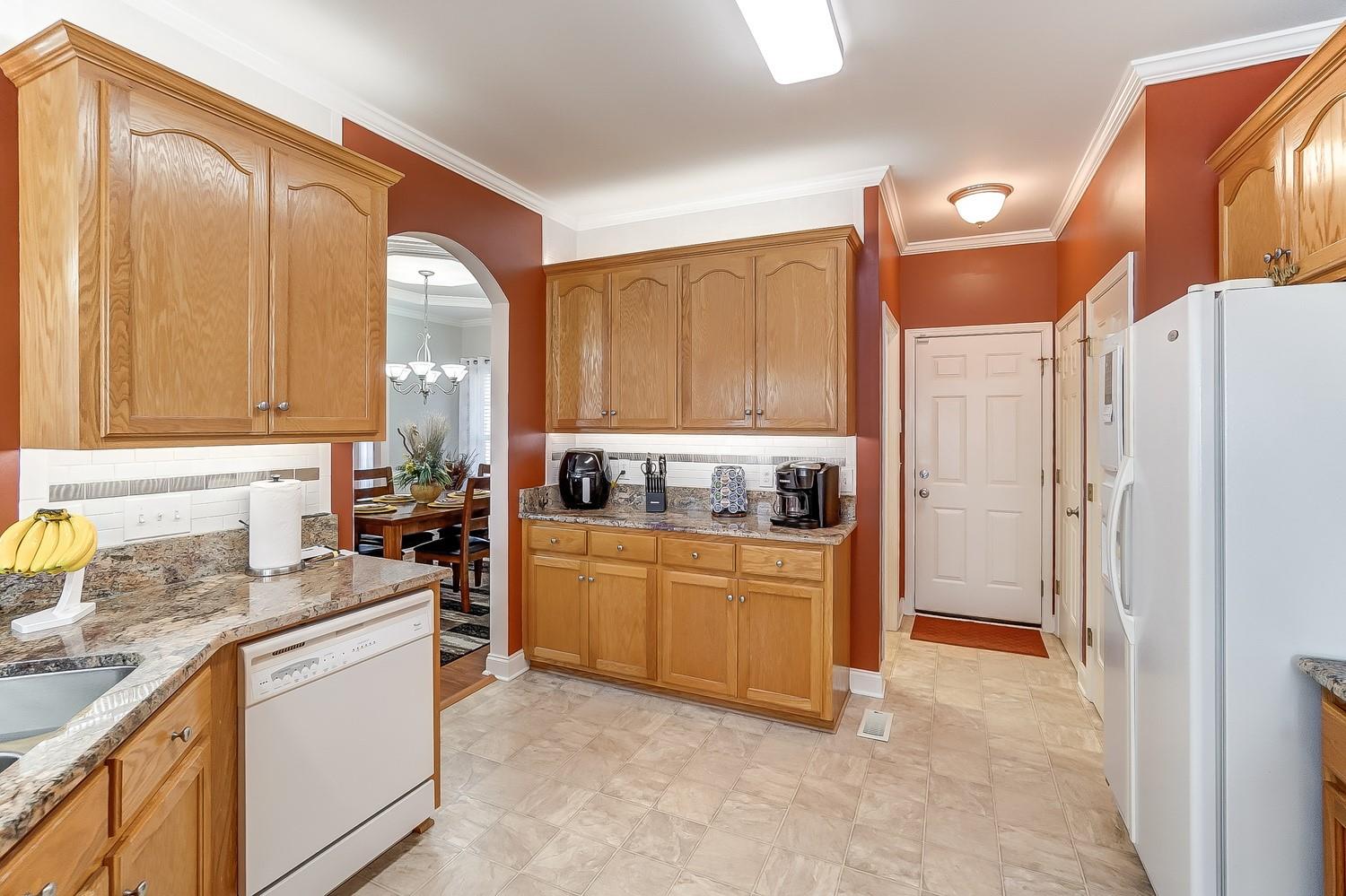 306 Wendover Drive Locust, NC 28097 - Photo 10 of 42 a kitchen with stainless steel appliances granite countertop a refrigerator a sink and white cabinets